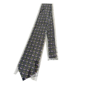 Hermes 100% silk twill necktie featuring a whimsical cow and palm tree motif