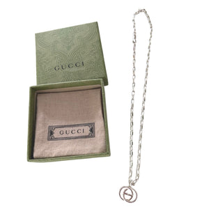 Gucci Britt Interlocking G Pendant Necklace crafted in high-polish .925 sterling silver
